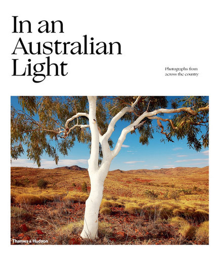 Cover of book with the title In an Australian Light with a photo of a white trunked eucalyptus tree in Central Australia, published by Thames and Hudson.